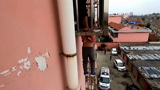 Firefighters rescue boy dangling from fourth-floor window in China