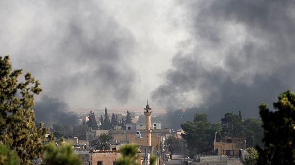 Smoke rises over the Syrian town of Ras al-Ain, as seen from the Turkish border town of Ceylanpinar, Sanliurfa province Smoke rises over the Syrian town of Ras al-Ain, as seen from the Turkish border town of Ceylanpinar, Sanliurfa province