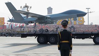 Military vehicle carrying a drone travels past Tiananmen Square during the military parade marking the 70th founding anniversary of People's Republic of China