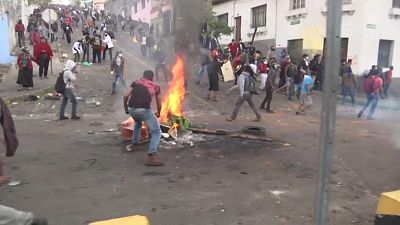 Rocks and tear gas as protesters clash with riot police in Ecuador