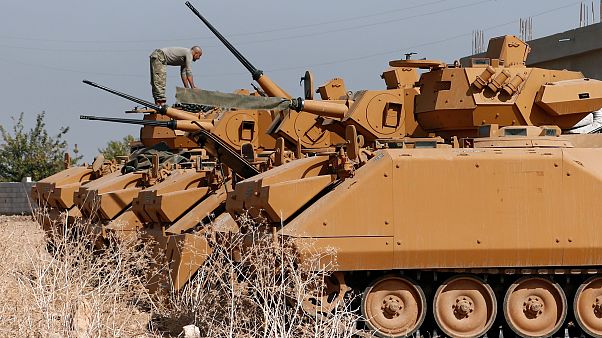 A Turkish soldier stands on top of an armoured personnel carrier near the Turkish-Syrian border in Sanliurfa province A Turkish soldier stands on top of an armoured personnel carrier near the Turkish-Syrian border in Sanliurfa province