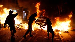 At least four detained as police clash with Catalan separatist supporters in Barcelona