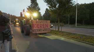 This banner reads 'Conscious farmer feeding the world'