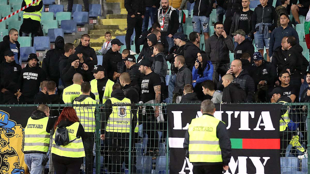 Stewards and Bulgaria fans during the Bulgaria-England Euro 2020 qualifier in Sofia on October 14, 2019