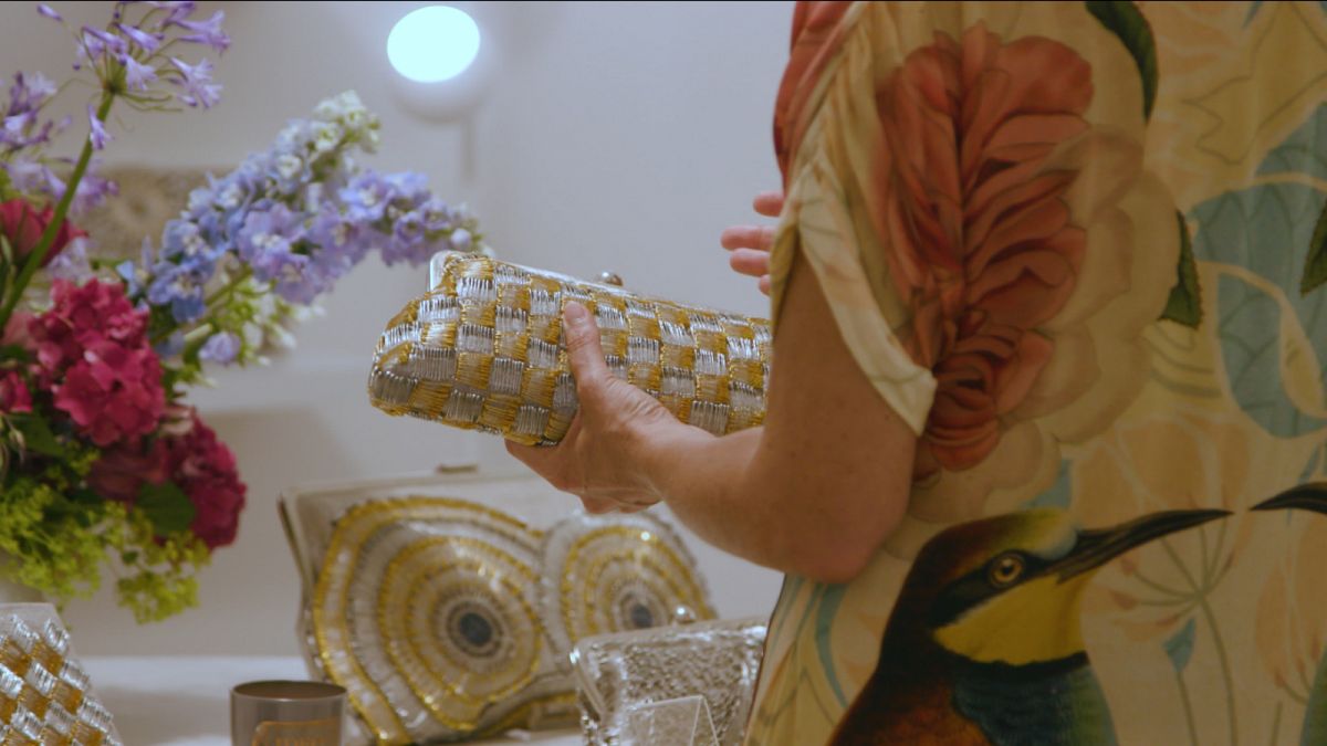 How are underprivileged women in Lebanon being empowered through luxury bags?