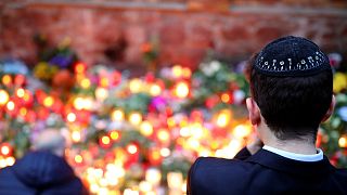 Mourners gather at the scene of the Halle synagogue attack