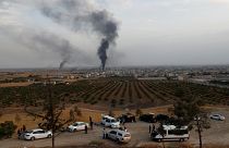 Smoke rises over the Syrian town of Ras al Ain, as seen from the Turkish border town of Ceylanpinar, in Sanliurfa province, Turkey, October 16, 2019.