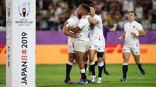 England's Anthony Watson celebrates with team mates scoring their fourth try REUTERS/Peter Cziborra