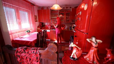 Lady in red: Bosnian has kept to the same colour all her adult life