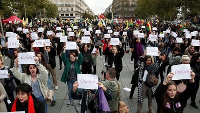 People attend a demonstration against femicide and violence against women at Place de la Republique in Paris
