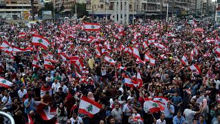 Demonstrators take part in an anti-government protest in Tripoli