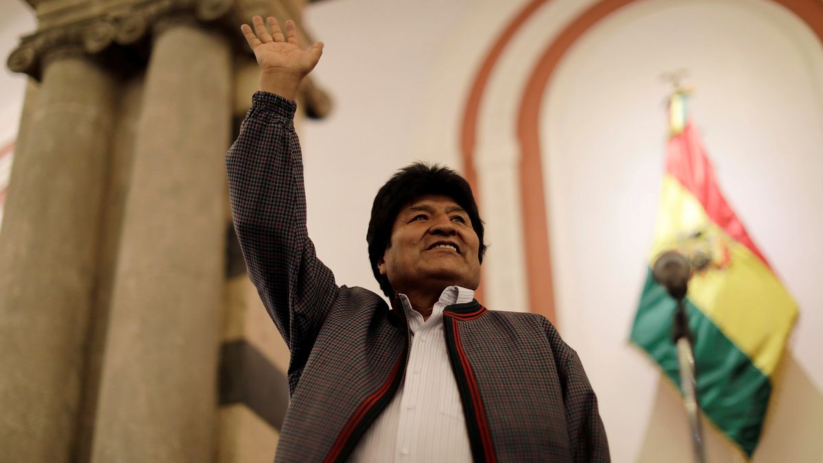 Evo Morales reacts after the results for the first round of the country's presidential election were announced