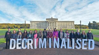 Campaigners mark the decriminalisation of abortion in Northern Ireland outside Stormont, in a demonstration organised by Amnesty International.