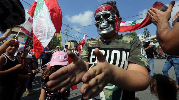 A demonstrator wearing a mask takes part in an anti-government protest in the southern city of Nabatiyeh, Lebanon October 21, 2019. A demonstrator wearing a mask takes part in an anti-government protest in the southern city of Nabatiyeh, Lebanon October 21, 2019.