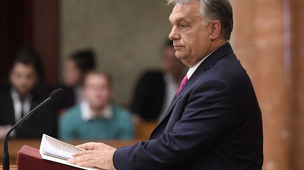 Hungarian opposition MP holds 'lies' sign during Orban's parliament speech Hungarian opposition MP holds 'lies' sign during Orban's parliament speech