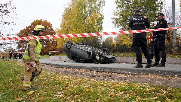 An overturn car is seen on the road, after it was allegedly struck by an ambulance which was stolen by an armed man in Oslo, Norway, October 22, 2019. An overturn car is seen on the road, after it was allegedly struck by an ambulance which was stolen by an armed man in Oslo, Norway, October 22, 2019.