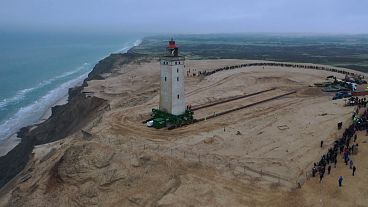 Danish lighthouse moved to save it from coastal erosion