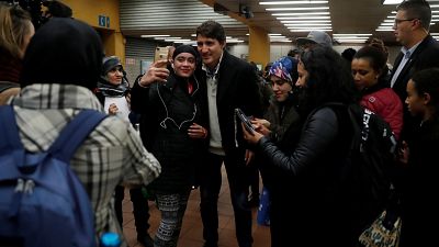 Canadian PM Justin Trudeau takes selfies with subway users in Montreal