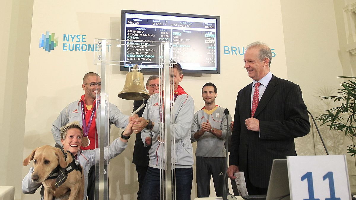 FILE PHOTO: Belgian athlete Marieke Vervoort rings a bell in the presence of fellow athletes, 2012s