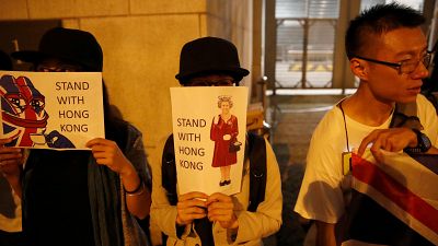 Activists form human chain at UK consulate in Hong Kong
