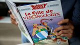 A journalist holds the new Asterix comic album named "La Fille De Vercingetorix" (Asterix and the ChieftainÕs daughterÊ) in Vanves near Paris, France, October 22, 2019.
