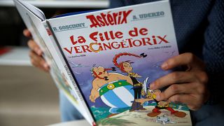 A journalist holds the new Asterix comic album named "La Fille De Vercingetorix" (Asterix and the ChieftainÕs daughterÊ) in Vanves near Paris, France, October 22, 2019.