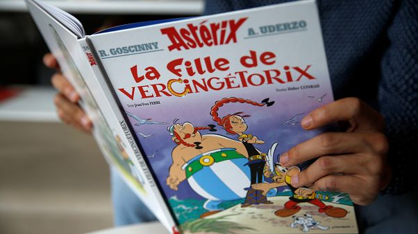 A journalist holds the new Asterix comic album named "La Fille De Vercingetorix" (Asterix and the ChieftainÕs daughterÊ) in Vanves near Paris, France, October 22, 2019. A journalist holds the new Asterix comic album named "La Fille De Vercingetorix" (Asterix and the ChieftainÕs daughterÊ) in Vanves near Paris, France, October 22, 2019.