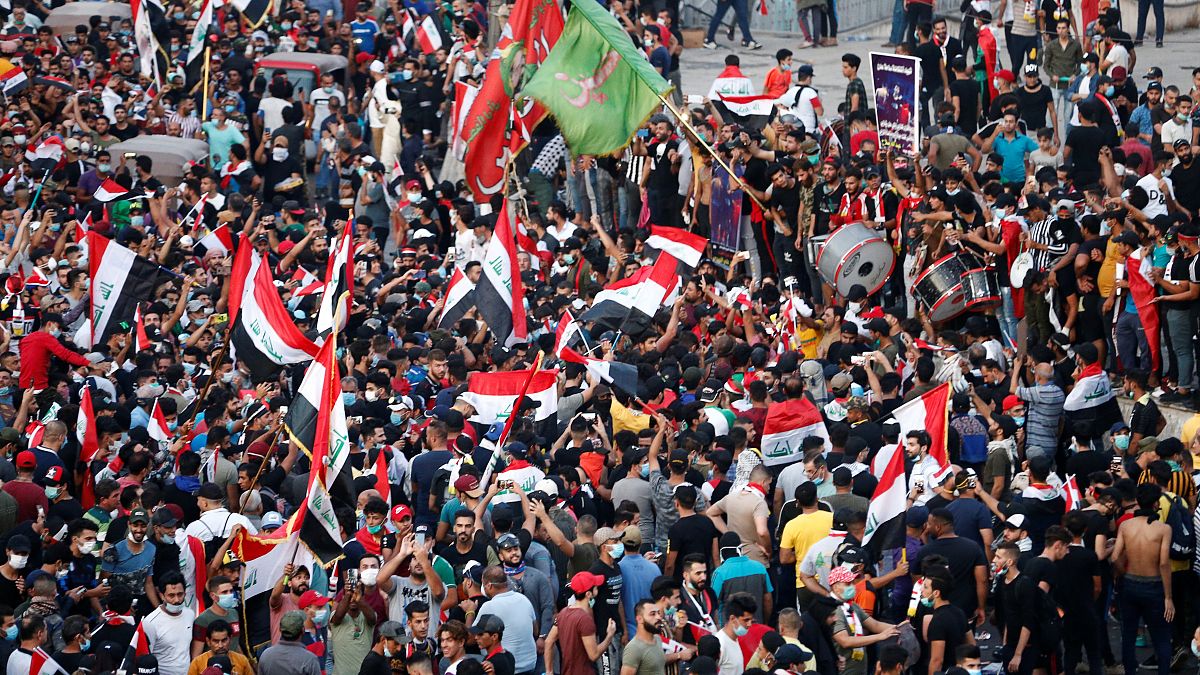 Demonstrators take part in a protest over corruption, lack of jobs, and poor services, in Baghdad
