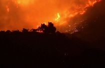 Thousands ordered to flee fast-moving Los Angeles wildfire