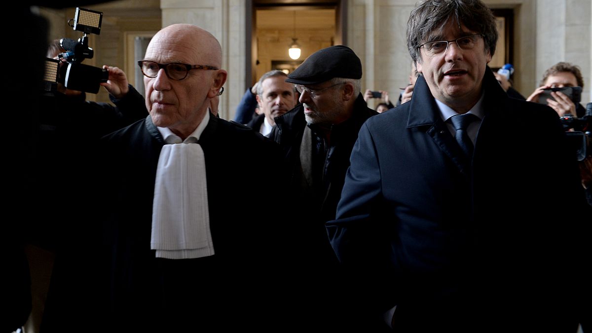 Former Catalan leader Carles Puigdemont arrives at court for his warrant case