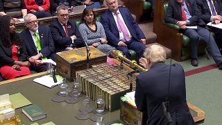 Britain's Prime Minister Boris Johnson speaks as Britain's opposition Labour Party leader Jeremy Corbyn listens at the House of Commons