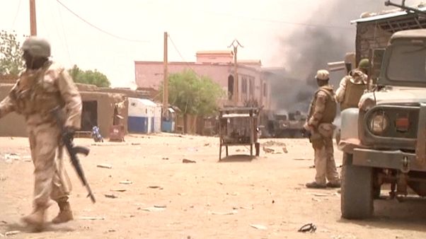 FILE: Soldiers stand guard as smoke rises in the distance after a car bomb attack in Gao, northern Mali July 1, 2018. FILE: Soldiers stand guard as smoke rises in the distance after a car bomb attack in Gao, northern Mali July 1, 2018.