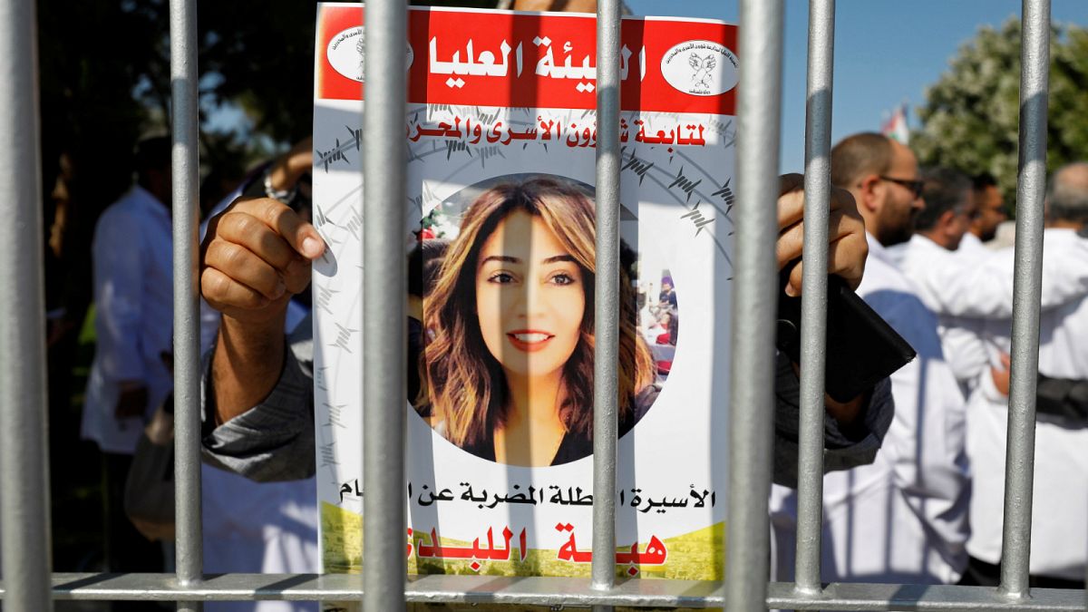 ملصق لهبة اللبدي أثناء مظاهرة في رام الله- الضفة الغربية، أرشيف رويترز