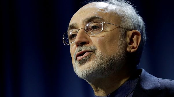 Iran scales back nuclear deal commitments as US imposes sanctions Iran scales back nuclear deal commitments as US imposes sanctions