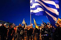 Supporters of the extreme-right Golden Dawn party sing the national anthem