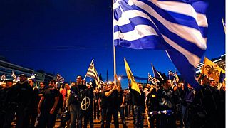 Supporters of the extreme-right Golden Dawn party sing the national anthem