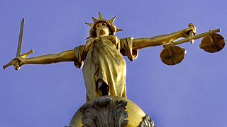 A statue over the Old Bailey court in central London.