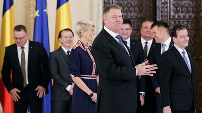 Romanian President Klaus Iohannis smiles as he adresses the audience at the end of the swearing-in ceremony of the Orban cabinet at the Cotroceni presidential palace