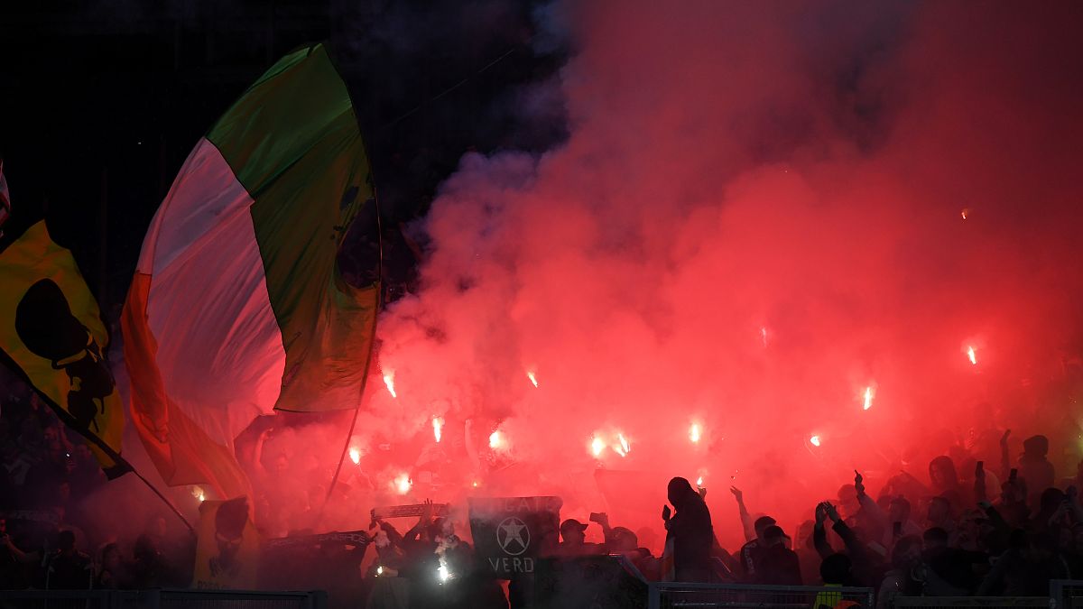 Lazio fans light flares before the match against Celtic on November 7.