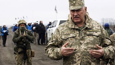 Senior Ukrainian army representative, Bogdan Bondar, speaks to the press during the withdrawal of the Ukrainian forces near Bogdanivka village