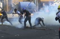 Iraqi security forces clash with anti-government protesters in Baghdad
