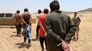 Men, who the Democratic Forces of Syria fighters claimed were Islamic State fighters, taken prisoners in Aleppo Governorate, Syria May 31, 2016.