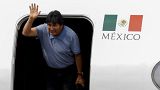 Bolivia's ousted President Evo Morales waves during his arrival to take asylum in Mexico City, Mexico, November 12, 2019