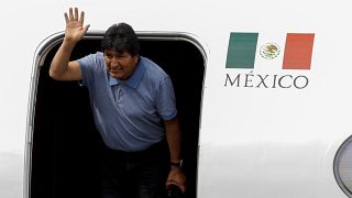 Bolivia's ousted President Evo Morales waves during his arrival to take asylum in Mexico City, Mexico, November 12, 2019