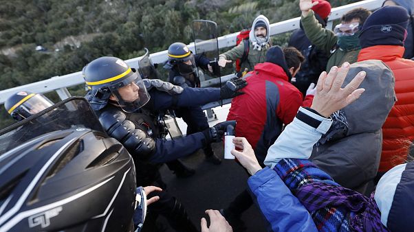 French police clash with Catalan protesters on the border French police clash with Catalan protesters on the border