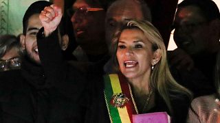 Bolivian Senator Jeanine Anez gestures after she declared herself as Interim President of Bolivia, at the balcony of the Presidential Palace, in La Paz