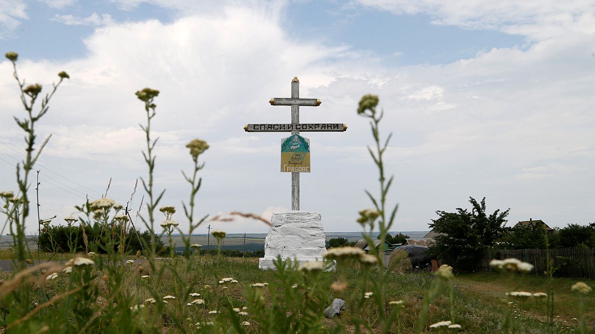 A view shows a cross near the crash site of Malaysia Airlines Flight MH17 plane outside Hrabove