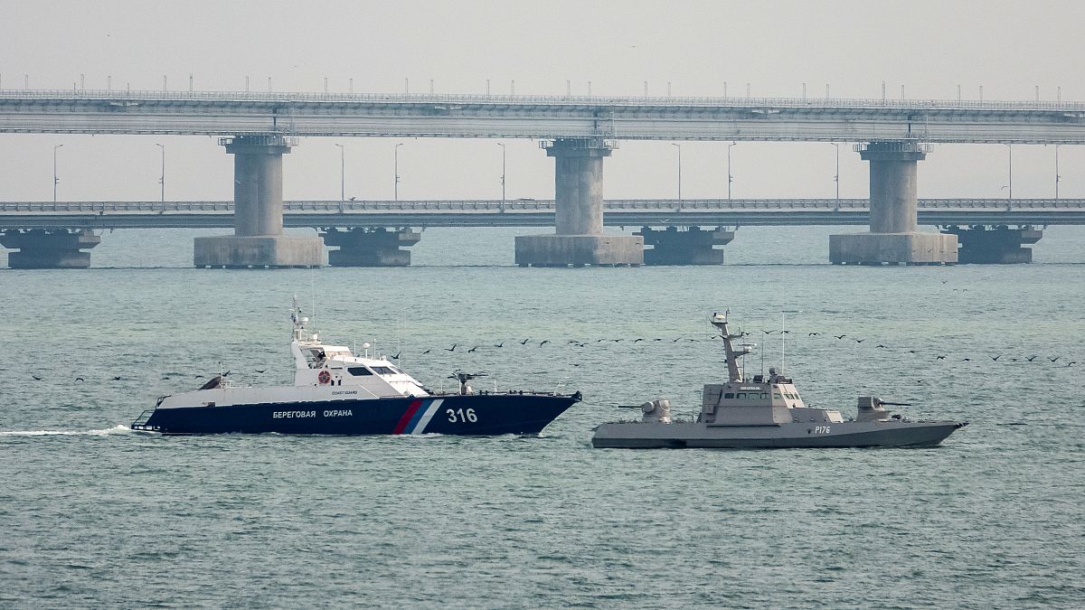 A seized Ukrainian ship is towed by a Russian Coast Guard vessel out of the port in Kerch, Crimea, November 17, 2019. 