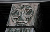 An image of scales is pictured on a pillar of the Supreme Court in Warsaw, Poland