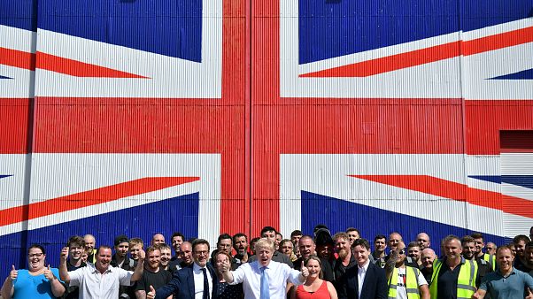 Boris Johnson with workers at the Wight Shipyard Company at Venture Quay during a visit to the Isle of Wight, Britain June 27, 2019. Boris Johnson with workers at the Wight Shipyard Company at Venture Quay during a visit to the Isle of Wight, Britain June 27, 2019.